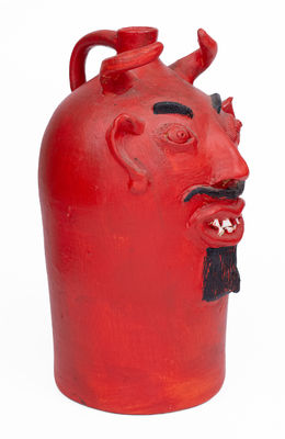 Red-Painted Pottery Devil Face Jug, 
