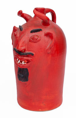 Red-Painted Pottery Devil Face Jug, 