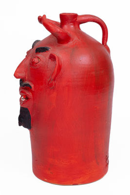Red-Painted Pottery Devil Face Jug, 