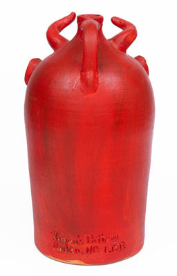 Red-Painted Pottery Devil Face Jug,