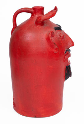Red-Painted Pottery Devil Face Jug, 