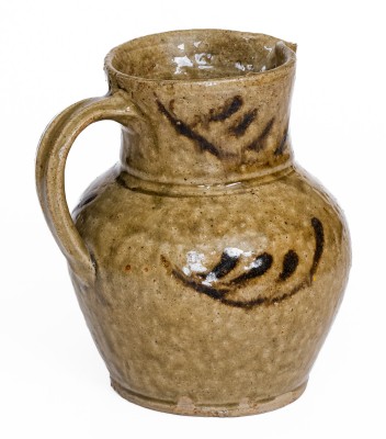 Rare Small-Sized Alkaline-Glazed Stoneware Pitcher with Iron Slip Decoration, attributed to Thomas Chandler, Edgefield District, SC, circa 1845.