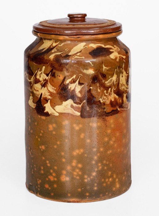 Rare Glazed Redware Jar with Marbled Slip Decoration, New England origin, first quarter 19th century.