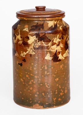 Rare Glazed Redware Jar with Marbled Slip Decoration, New England origin, first quarter 19th century.