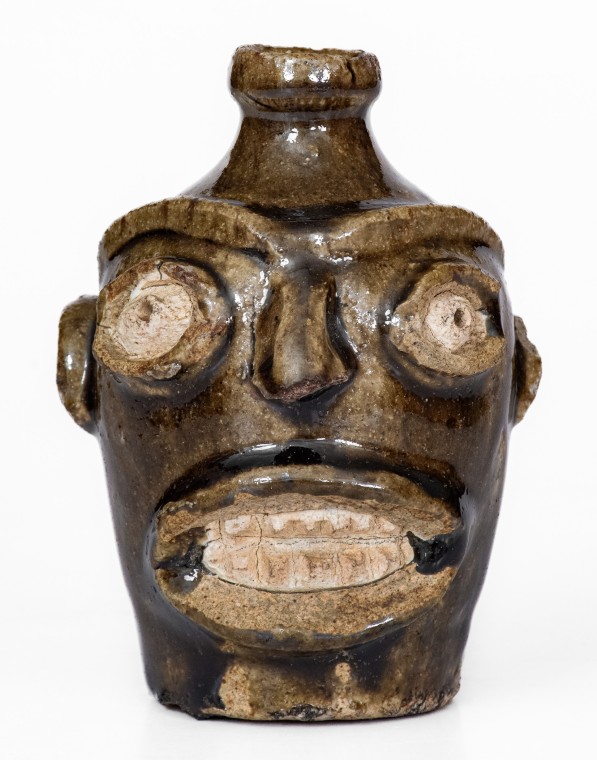 Rare Alkaline-Glazed Stoneware Face Jug, Edgefield District, SC origin, third quarter 19th century.