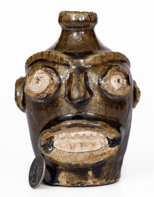 Rare Alkaline-Glazed Stoneware Face Jug, Edgefield District, SC origin, third quarter 19th century.