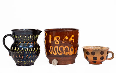 Three Pieces of Slip-Decorated Redware, European, 19th century