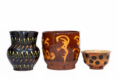 Three Pieces of Slip-Decorated Redware, European, 19th century