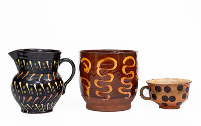 Three Pieces of Slip-Decorated Redware, European, 19th century