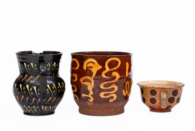 Three Pieces of Slip-Decorated Redware, European, 19th century