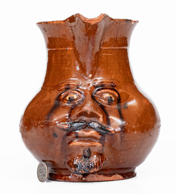 Extremely Rare Pennsylvania Redware Face Pitcher, 19th century