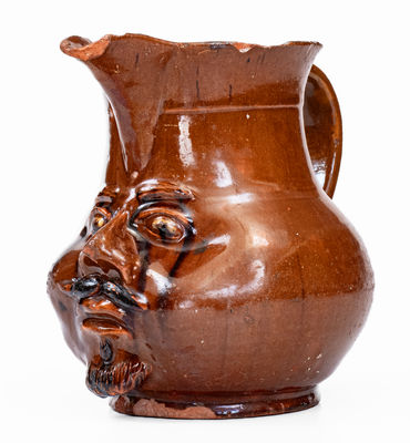 Extremely Rare Pennsylvania Redware Face Pitcher, 19th century