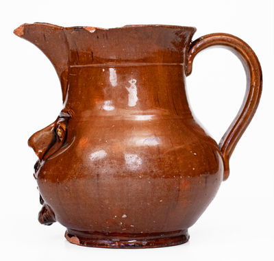 Extremely Rare Pennsylvania Redware Face Pitcher, 19th century
