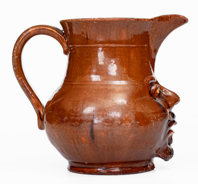 Extremely Rare Pennsylvania Redware Face Pitcher, 19th century