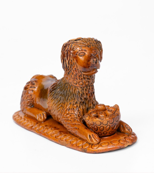 Rare and Important Redware Figure of a Dog with Basket, attrib. John Bell, Waynesboro, PA