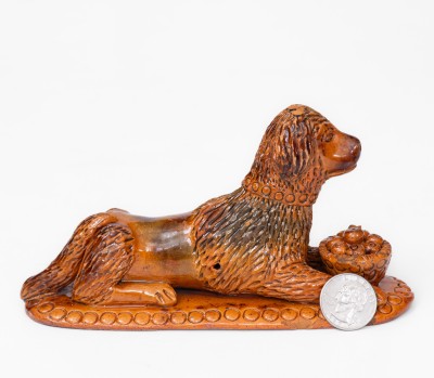 Rare and Important Redware Figure of a Dog with Basket, attrib. John Bell, Waynesboro, PA