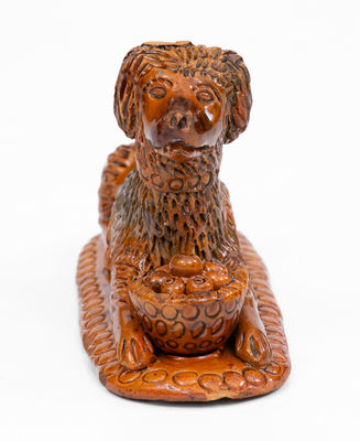 Rare and Important Redware Figure of a Dog with Basket, probably John Bell Pottery, Waynesboro, PA
