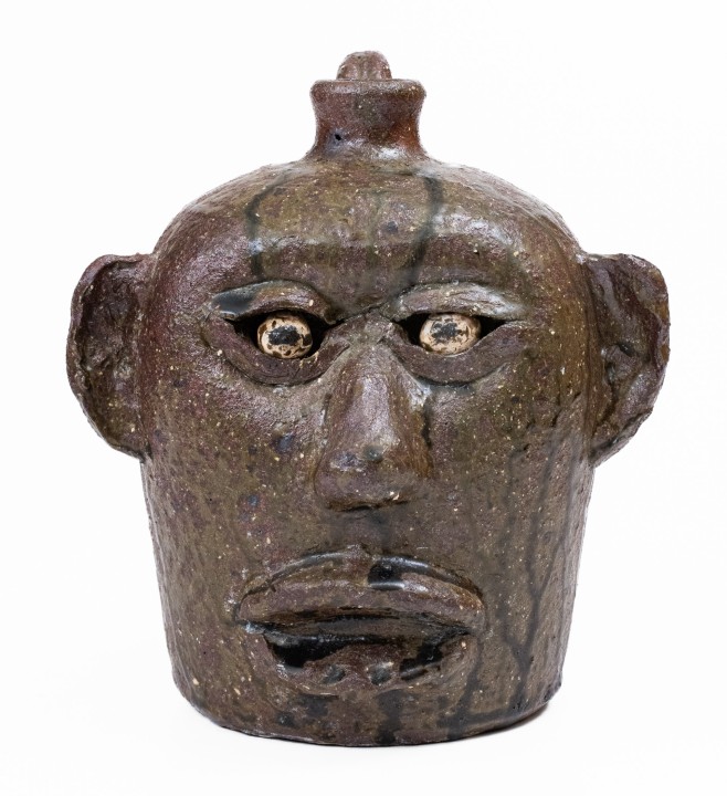 Alkaline-Glazed Stoneware Face Jug with Open Mouth Lacking Teeth, Signed 