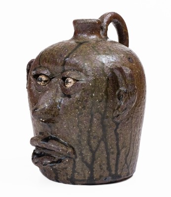 Alkaline-Glazed Stoneware Face Jug with Open Mouth Lacking Teeth, Signed 