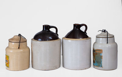 Lot of Four: Stoneware Vessels w/ Paper Labels incl. Marked WESTERN STONEWARE CO. Example