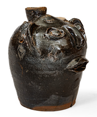 Rare Alkaline-Glazed Stoneware Face Harvest Jug, probably Upstate SC, late 19th / early 20th century