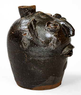 Rare Alkaline-Glazed Stoneware Face Harvest Jug, probably Upstate SC, late 19th / early 20th century