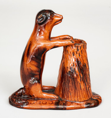 Glazed Pennsylvania Redware Figure of a Dog with Stump, circa 1850-1880