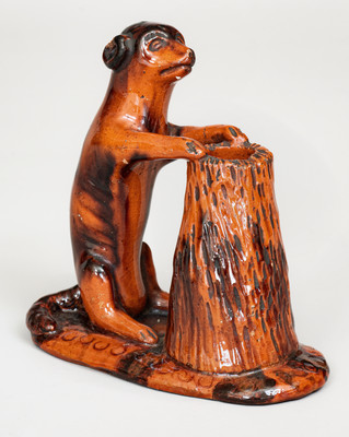 Glazed Pennsylvania Redware Figure of a Dog with Stump, circa 1850-1880