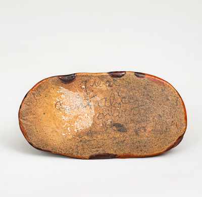 Glazed Pennsylvania Redware Figure of a Dog with Stump, circa 1850-1880