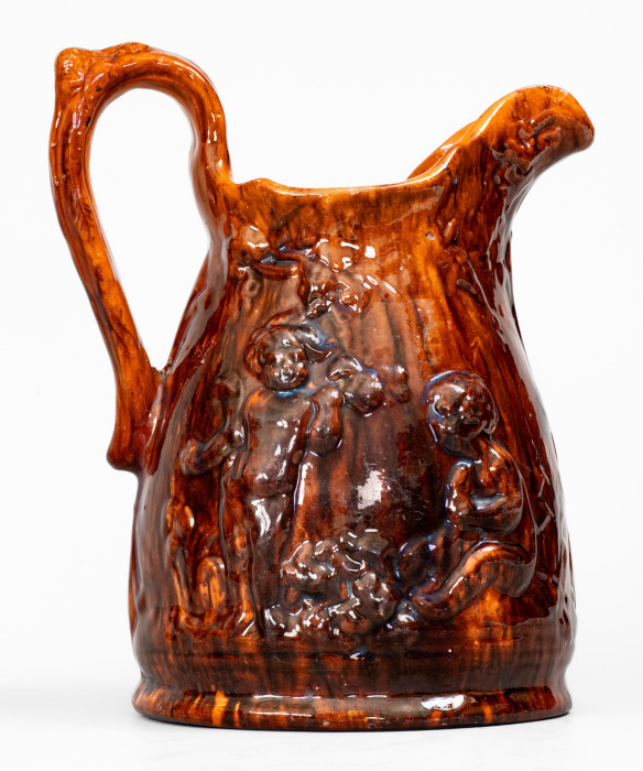 Rare Glazed Pottery Pitcher with Relief Cherub Pattern, Stamped 