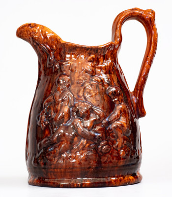 Rare Glazed Pottery Pitcher with Relief Cherub Pattern, Stamped 