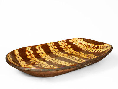 Outstanding Large-Sized Slip-Decorated Redware Loaf Dish, English origin, 19th century