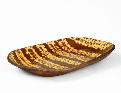 Outstanding Large-Sized Slip-Decorated Redware Loaf Dish, English origin, 19th century