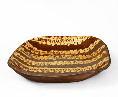 Outstanding Large-Sized Slip-Decorated Redware Loaf Dish, English origin, 19th century