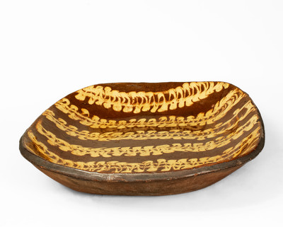 Outstanding Large-Sized Slip-Decorated Redware Loaf Dish, English origin, 19th century