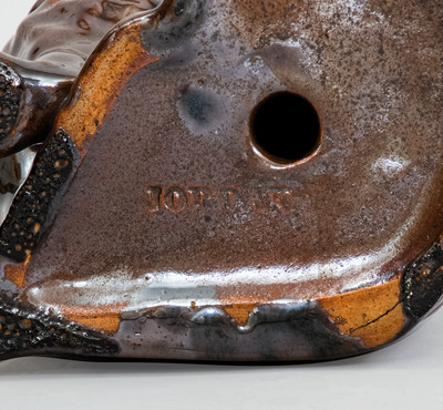 Scarce JORDAN, New York Albany-Slip-Glazed Stoneware Spaniel, mid 19th century