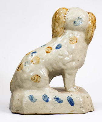 Scarce Stoneware Spaniel on Base with Two-Color Slip Decoration, attributed to the Donaghho Pottery, Parkersburg WV, circa 1890.