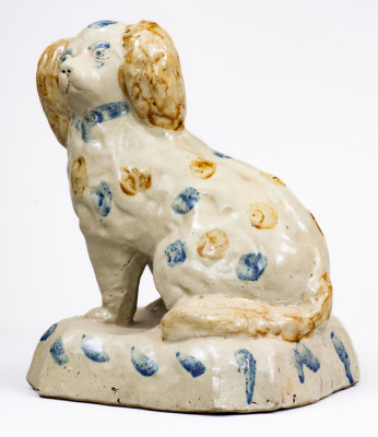 Scarce Stoneware Spaniel on Base with Two-Color Slip Decoration, attributed to the Donaghho Pottery, Parkersburg WV, circa 1890.