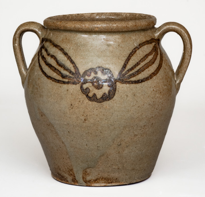 Very Rare Open-Handled Alkaline-Glazed Stoneware Jar with Iron Slip Floral Decoration, attributed to Phoenix Factory, Shaw s Creek, Edgefield District, SC, circa 1840.