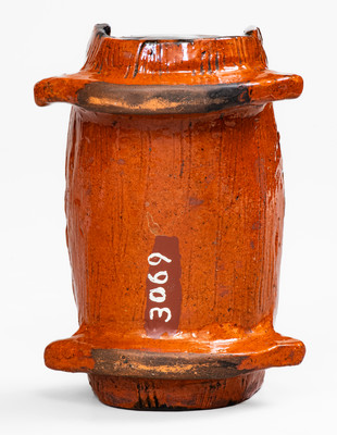 Rare and Important Figural Redware Baby-in-Cradle Bank, probably Pennsylvania