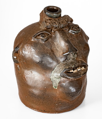 Very Rare Georgia Stoneware Face Jug w/ Applied Lizard, late 19th century