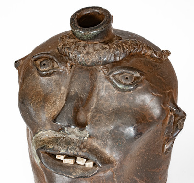 Very Rare Georgia Stoneware Face Jug w/ Applied Lizard, late 19th century