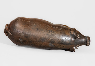 Early Anna Pottery Albany-Slip-Glazed Stoneware Pig Flask, circa 1865