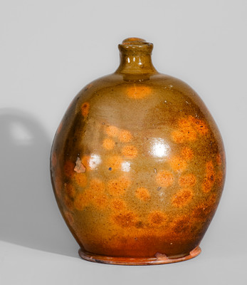 Highly Ovoid New England Redware Jug, early 19th century