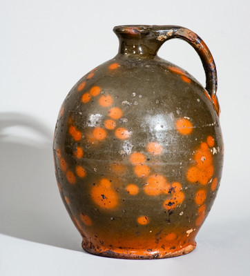 Highly Ovoid New England Redware Jug, first half 19th century