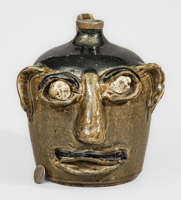 Exceedingly Rare and Important Early-Period Lanier and Arie Meaders Face Jug w/ Rock Eyes and Black Slip