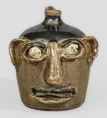 Exceedingly Rare and Important Early-Period Lanier and Arie Meaders Face Jug w/ Rock Eyes and Black Slip