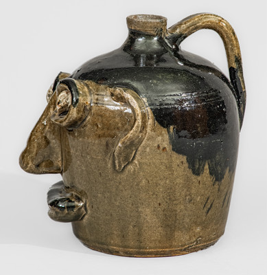 Exceedingly Rare and Important Early-Period Lanier and Arie Meaders Face Jug w/ Rock Eyes and Black Slip