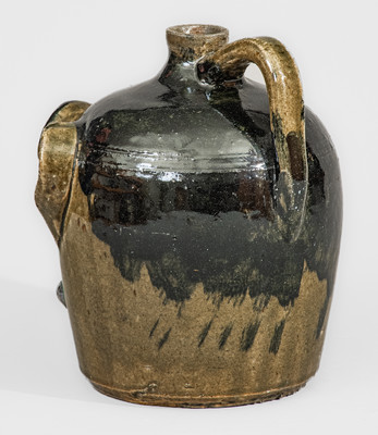 Exceedingly Rare and Important Early-Period Lanier and Arie Meaders Face Jug w/ Rock Eyes and Black Slip