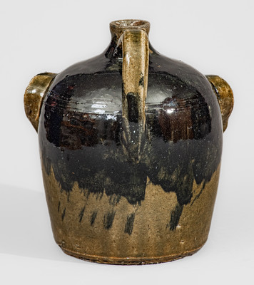 Exceedingly Rare and Important Early-Period Lanier and Arie Meaders Face Jug w/ Rock Eyes and Black Slip